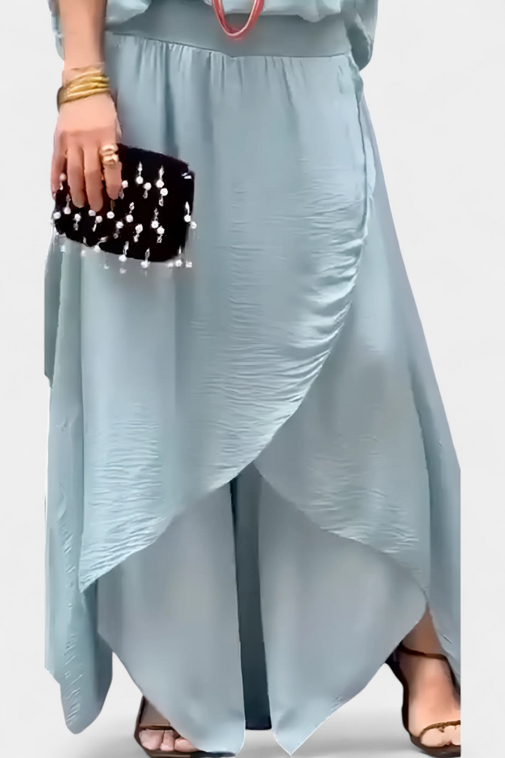 Maravilla dviejų dalių plazdantis komplektas su laisvu topu ir asimetrine sijonu